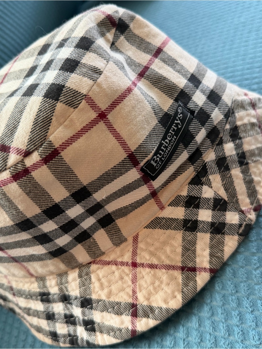 Burberry Classic Beige Plaid Bucket Hat with Black and Red Accents